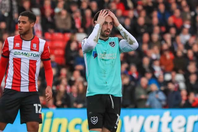 Owen Dale holds his head in his hands during today's goalless draw at Lincoln