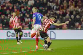 Colby Bishop attempts a back-heeled shot in the first half of Pompey's clash at Sheffield United. Picture: Jez Tighe