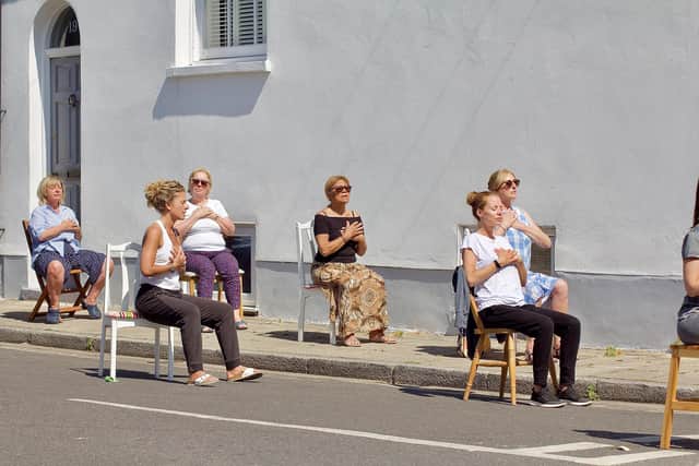 Maxine Bailey-Green leading socially-distanced yoga sessions in Wilton Terrace, Southsea. Picture by James Wileman