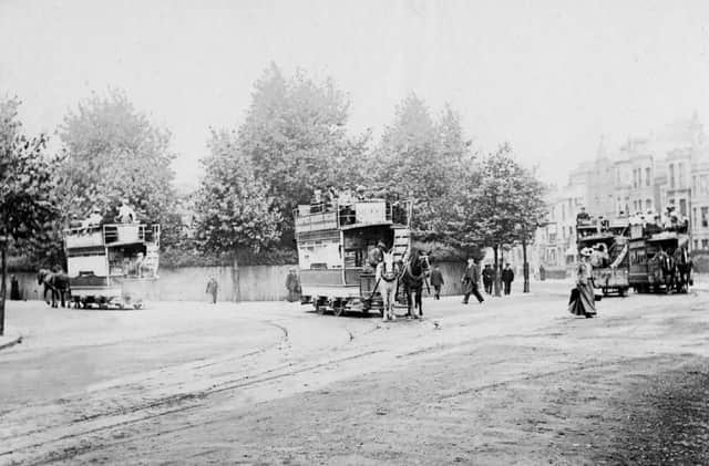 Horse trams of the Provincial Tramway Company with Museum Road going off to the left and Landport Terrace behind the female pedestrian