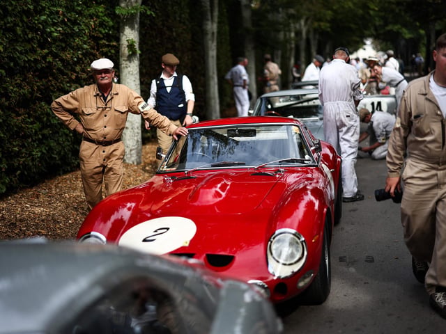 Mechanics prepare classic cars ahead of a race during the opening day of Goodwood Revival at the Goodwood Motor Circuit in Chichester on September 8, 2023. The only historic motor race meeting to be staged entirely in a period theme, Goodwood Revival is an immersive celebration of iconic cars and fashion.