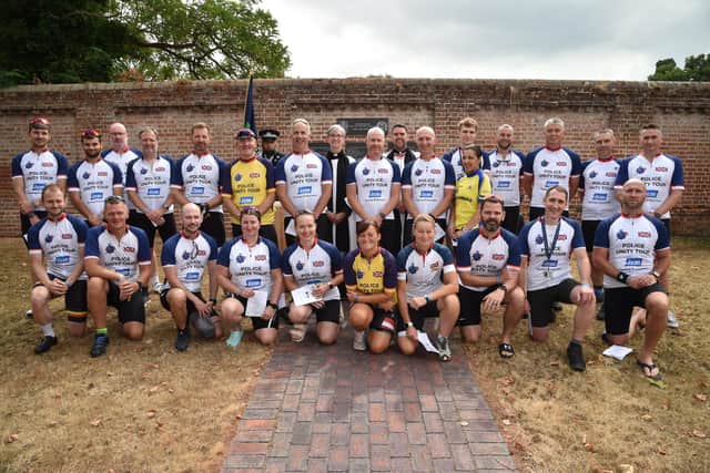 Hampshire Police officers and staff taking part in the Unity cycle race event, a 220-mile charity bike ride raising money for families of those who have died in the line of duty.
