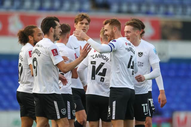 The Pompey players rush to congratulate Tom Naylor for his goal against Ipswich.  Picture: Nigel Keene