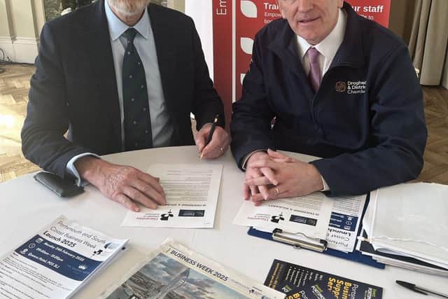 WORKING TOGETHER. Hampshire Chamber Chief Executive and Executive Chairman Ross McNally, left, and Drogheda Chamber Chief Executive Hubert Murphy sign the ‘friendship and solidarity twinning agreement’ in Portsmouth.