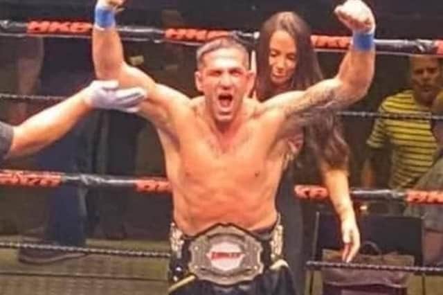Mickey Parker lets out a roar with the BKB British cruiserweight title around his waist