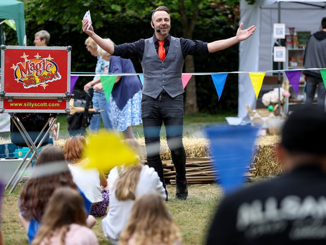 Magician Silly Scott entertains the crowds. Picture: Chris Moorhouse (160825-25)