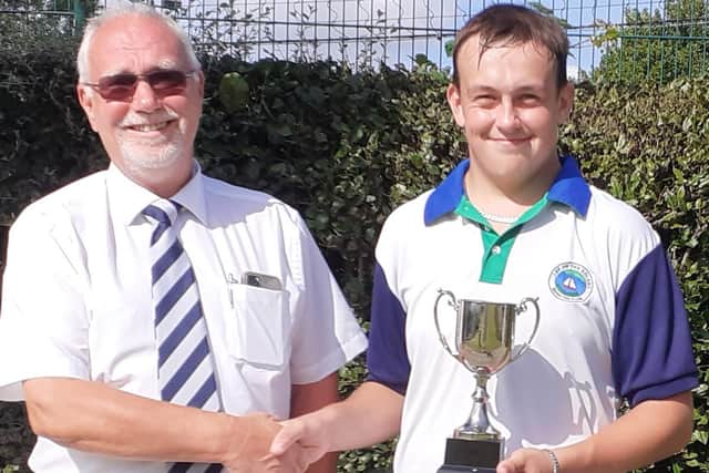 Under-18s single champion Joshua Thompson with Simon Batcheler, the acting P&D competition secretary