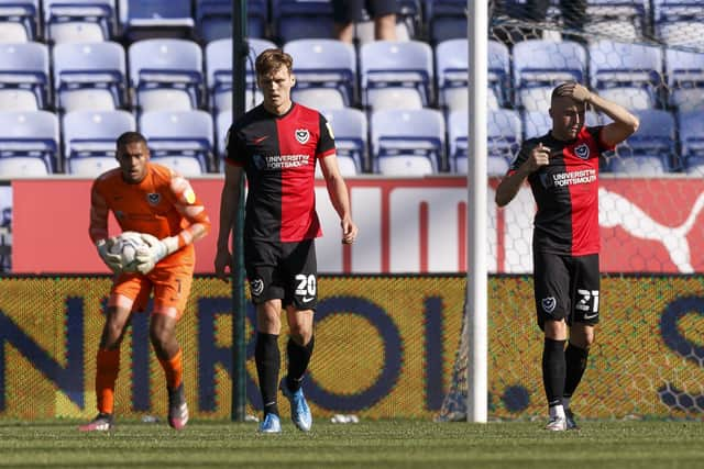 Sean Raggett and Joe Morrell look dejected after Callum Lang's 78th-minute winner at the DW Stadium.  Picture: Daniel Chesterton/phcimages.com)