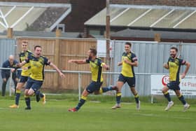 Moneyfields' Tom Cain is chased by his team-mates after netting the opening goal. Picture: Stuart Martin (220421-7042)