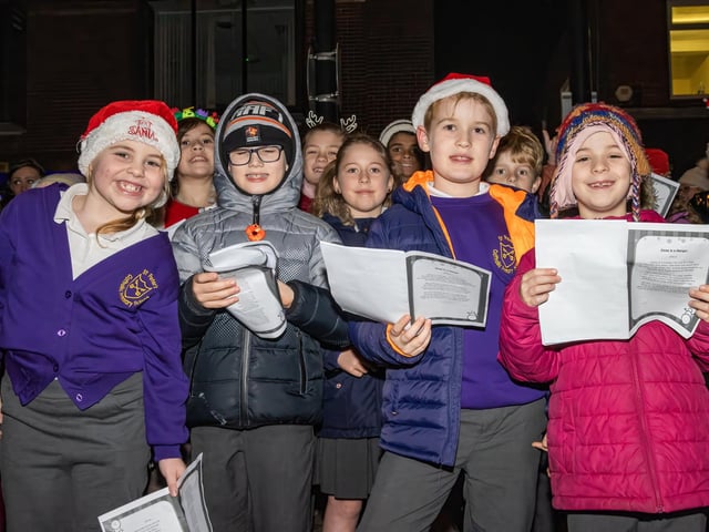 School choirs joined the Denmead Brass Band to sing Christmas carols.  Photos by Alex Shute