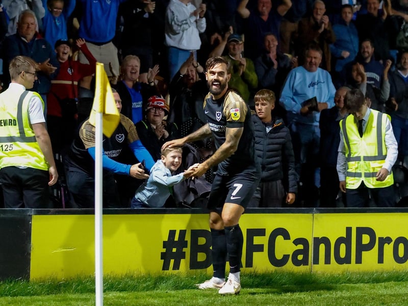 Marlon Pack celebrates with a young Pompey fan following his help drying the ball in the Blues' 2-0 win at Burton on Tuesday, September 13.
