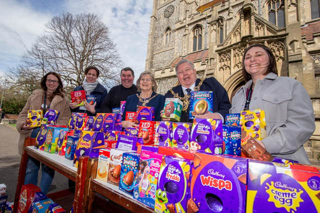 Father Bob White said even though it seems like a small gesture, the Easter eggs will bring joy to struggling families. Pictured: Charlotte Ferguson of STOP Domestic Abuse, Donna Burney of Roberts centre, Father Bob White, Moyoress Mrs Joy Maddox, Lord Mayor Frank Jonas and Emily Price of STOP Domestic Abuse outside St Marys church, Fratton, Portsmouth with the donated Easter eggs. Picture: Habibur Rahman