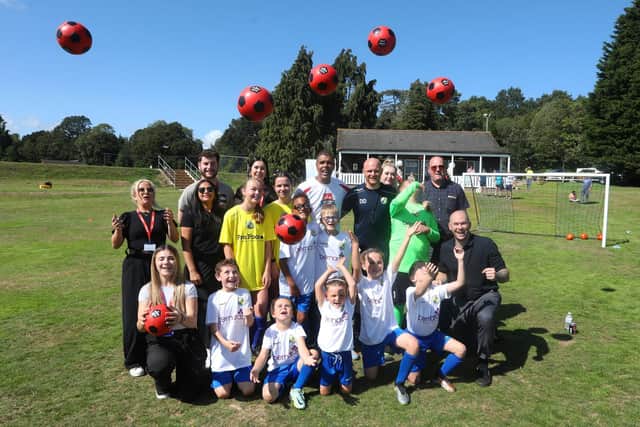 Pictured: Chris Kamara with some of the Hawks Community Youth FC team. Picture: Sam Stephenson.