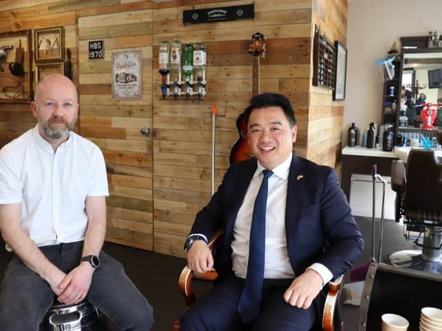 Mark Griffiths, owner of Hayling Barber Shop, and Alan Mak, MP for Gosport.
