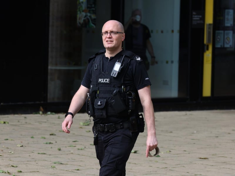 Police kept a watchful eye over the station at the scene.