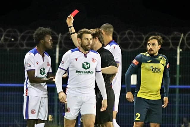 Gosport sub Billie Busari is shown a red card for retaliation. Picture by Tom Phillips