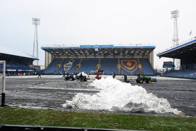 In 2010 hundreds of Pompey fans helped clear snow at Fratton Park ahead of a game. In exchange the fans each got a pair of tickets. Picture: Paul Jacobs  (100088-11)