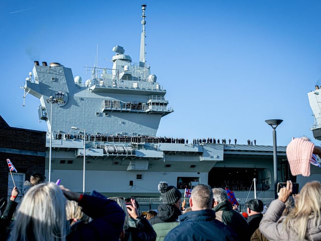 Pictured: Families gather at Portsmouth Naval Base as HMS Prince of Wales makes her glorious return home.