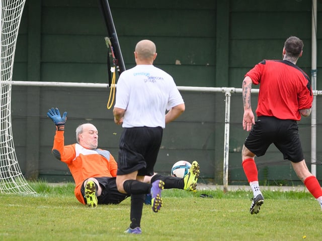Action from the Jon Gittens memorial charity match between a team of former Fareham Town players and a side of ex-Pompey and Southampton professionals. Picture: Keith Woodland (160421-598)
