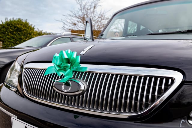 Vehicles in the funeral procession were decorated with a green ribbon, referencing Jax's nickname "The Little Frog". Picture: Mike Cooter (160324)