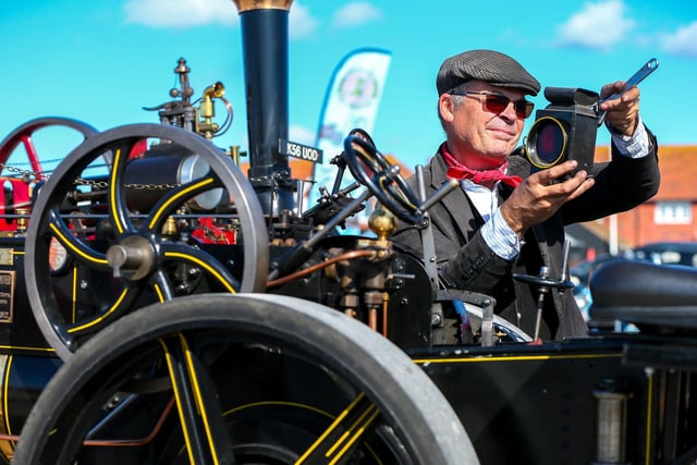 Chris Blight makes adjustments on the half-size Savage Brothers 'Little Samson' traction engine.