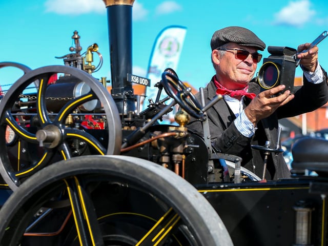 Chris Blight makes adjustments on the half-size Savage Brothers 'Little Samson' traction engine.
