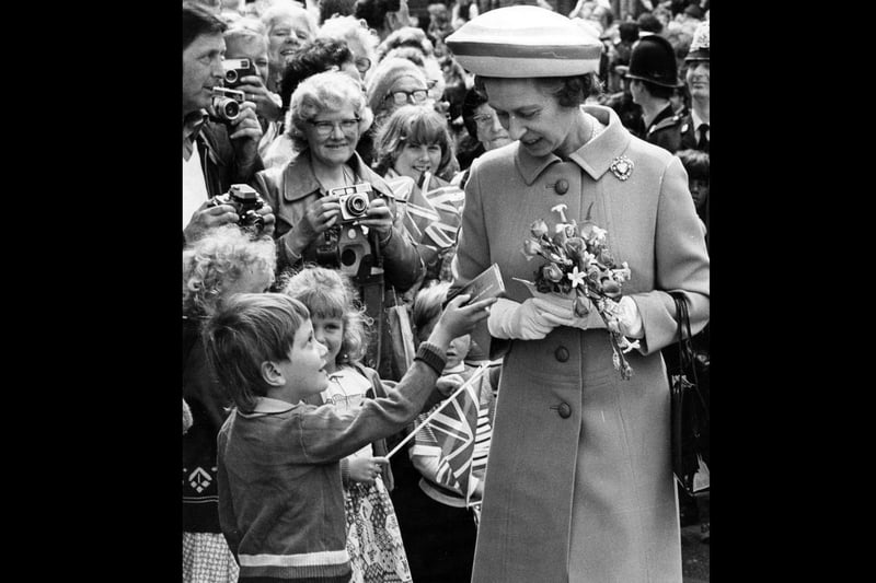 Chocolate for the Queen during a walkabout in Guildhall Square on July 11, 1986. The News PP4046