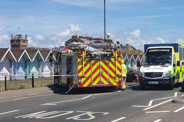 Emergency services on Eastney Esplanade in Portsmouth on June 28, 2022, after a car flipped near the junction with St George's Road. Picture: Habibur Rahman