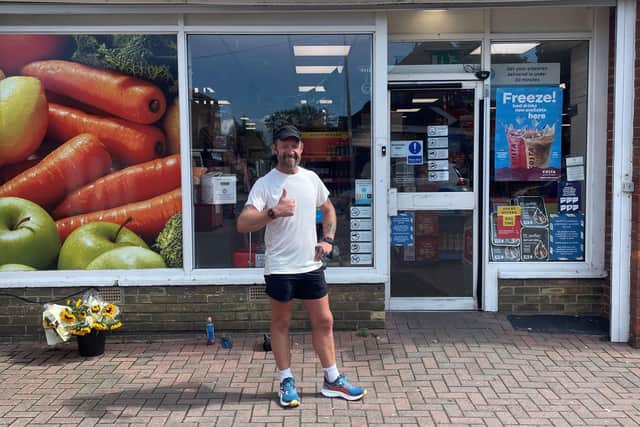 Chris Wilby outside a One Stop store.