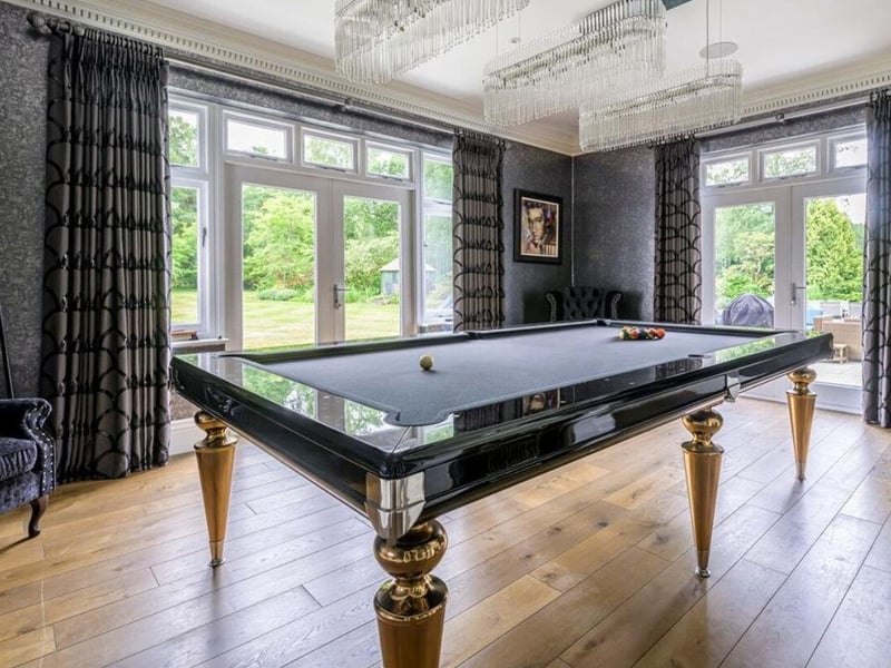 The listings says: "This magnificent country home offers extremely generous accommodation including seven bedrooms, four reception rooms, garaging for five cars, spectacular indoor pool complex and meticulously maintained gardens extending to about 5 acres."