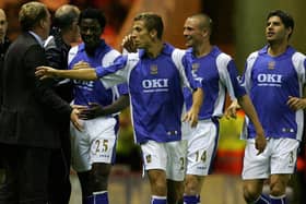Pompey boss Harry Redknapp, left, with Benjani, Gary O'Neil, Matt Taylor and Dejan Stefanovic.     Picture: Matthew Lewis/Getty Images