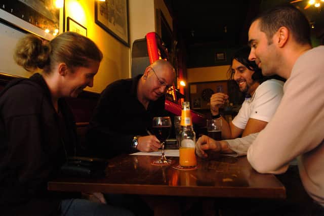 Friends enjoy the pub quiz at the Mary Rose pub in Portsmouth