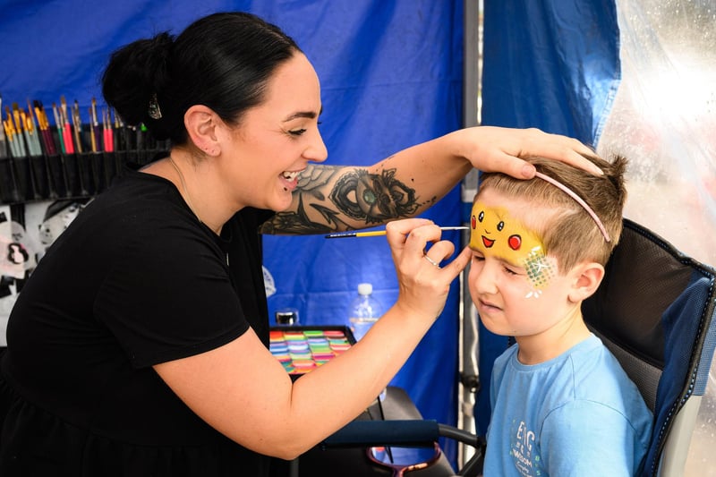 Pictured is: Cheri Hopson paints a face on Rees Wilton.
Picture: Keith Woodland (100921-10)