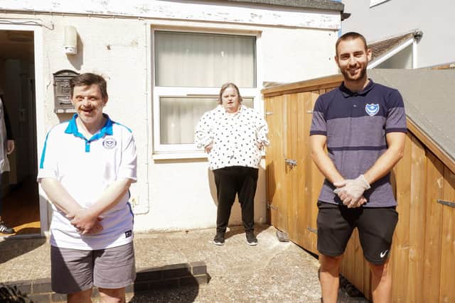 Portsmouth FC player Ben Close delivering care packages to staff at Community Integrated Care who support hundreds of people who have learning disabilities, autism and mental health concerns across our Hampshire.
caption: Ben Close with people supported by Community Integrated Care.
Picture: Community Integrated Care