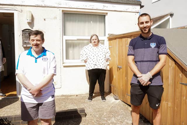 Portsmouth FC player Ben Close delivering care packages to staff at Community Integrated Care who support  hundreds of people who have learning disabilities, autism and mental health concerns across our Hampshire.
caption: Ben Close with people supported by Community Integrated Care.
Picture: Community Integrated Care