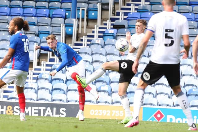 Ronan Curtis curls home for Pompey. Picture: Joe Pepler