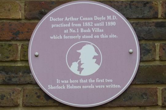 It may not be blue, but Arthur Conan Doyle is celebrated with a brown plaque which can be found on the side of Bush House, Elm Grove, Southsea where first two Sherlock Holmes novels were written. He practiced as a doctor in the city at No. 1 Bush Villas which formerly stood on the site.
