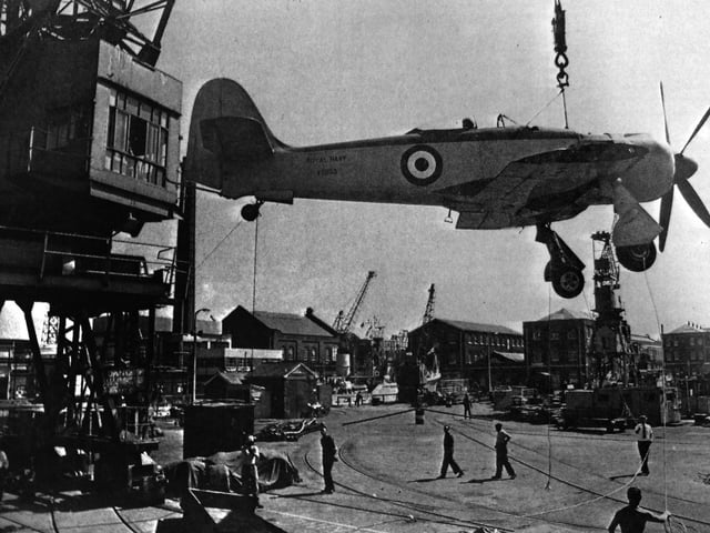 Airborne: This was the last flight of a Sea Fury fighter bomber which served in the Korean War. She was hauled into the air from the deck of RFA Robert Dundas in Portsmouth Dockyard by crane, before being sailed to Fleetlands, Gosport, as an open day attraction. She would later be transported to Yeovilton Royal Naval Air Station, where she would be placed in the Fleet Air Arm Museum. The News (4026-1)