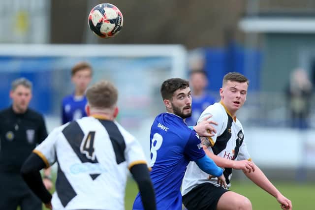 Dillon North (blue) ended Stoneham's 19-game winning Wessex League home run with an equaliser for Baffins Milton Rovers. Picture: Chris Moorhouse