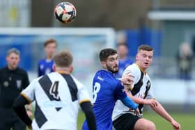Dillon North (blue) ended Stoneham's 19-game winning Wessex League home run with an equaliser for Baffins Milton Rovers. Picture: Chris Moorhouse