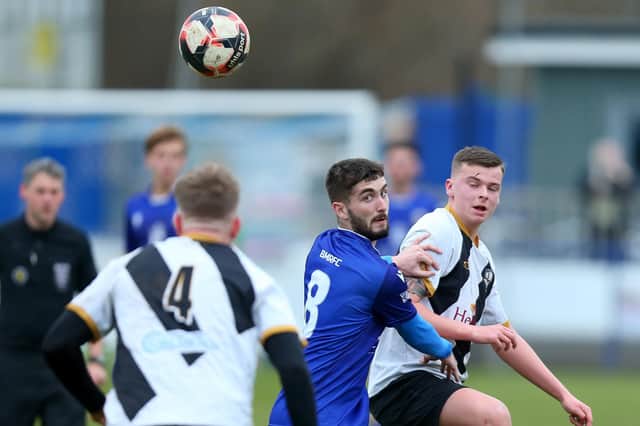 Dillon North (blue) ended Stoneham's 19-game winning Wessex League home run with an equaliser for Baffins Milton Rovers. Picture: Chris Moorhouse