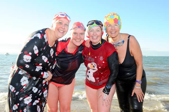 Sharon Noble (far left), raising money with the Shack Sharks Swimming Club at this year's New Year's Day Swim.

Picture: Sarah Standing