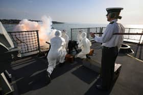 Pictured: The ship's company ceremonial firing party.