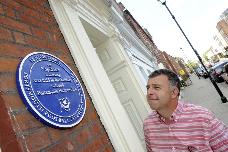 The birthplace of Portsmouth Football is marked with a plaque at 12 High Street, Old Portsmouth where the meeting was held to found the club in 1898
Pictured: Pompey fan Rick Hawkins from Fareham shows an interest in the Portsmouth Football Club plaque
Picture: Ian Hargreaves (141665-4)