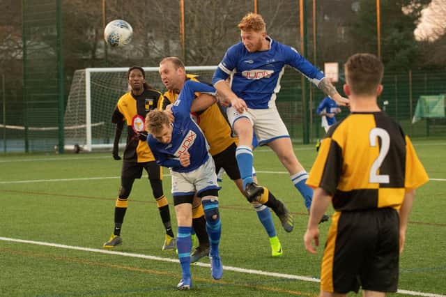 Denmead (blue) on the attack during a Hampshire Premier League game against Michelmersh. Picture: Keith Woodland