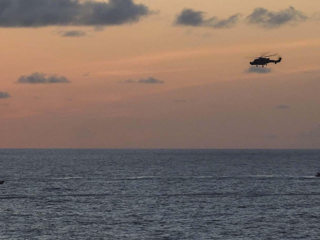 HMS Dauntless conducting a drugs intervention/rescue mission whilst operating in the Caribbean region.