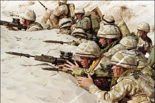 British soldiers from the First Stafford, well known as the 'Desert Rats', stand in a trench on January 6, 1991. Picture: PATRICK BAZ/AFP via Getty Images