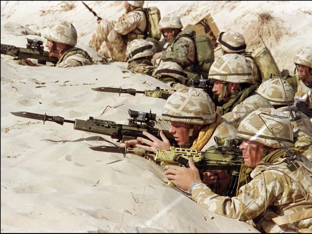 British soldiers from the First Stafford, well known as the 'Desert Rats', stand in a trench on January 6, 1991. Picture: PATRICK BAZ/AFP via Getty Images