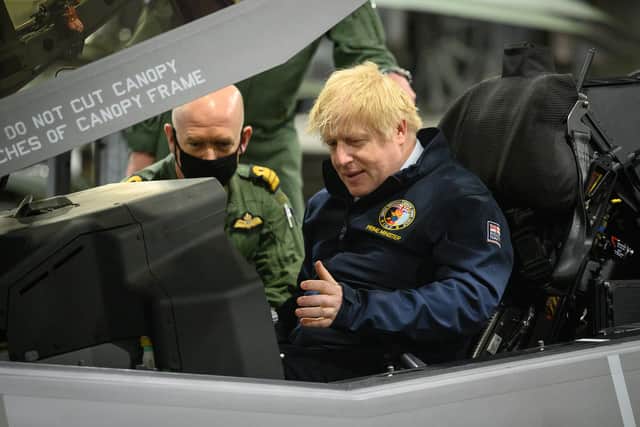 Prime Minister Boris Johnson sits in the cockpit of an Lockheed Martin F-35 Lightning II during a visit to HMS Queen Elizabeth aircraft carrier on May 21Picture: Leon Neal - WPA Pool/Getty Images