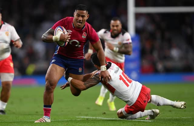 Manu Tuilagi of England breaks the tackle of Kurt Morath of Tonga during the Quilter Autumn Nations Series match between England and Tonga at Twickenham Stadium on November 06, 2021 in London, England. Photo by Mike Hewitt/Getty Images